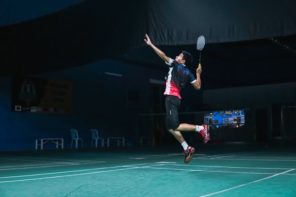 Girls and boys playing Badminton