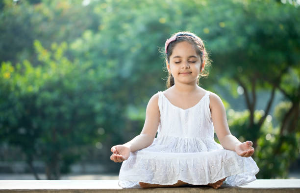Girls and boys doing yoga